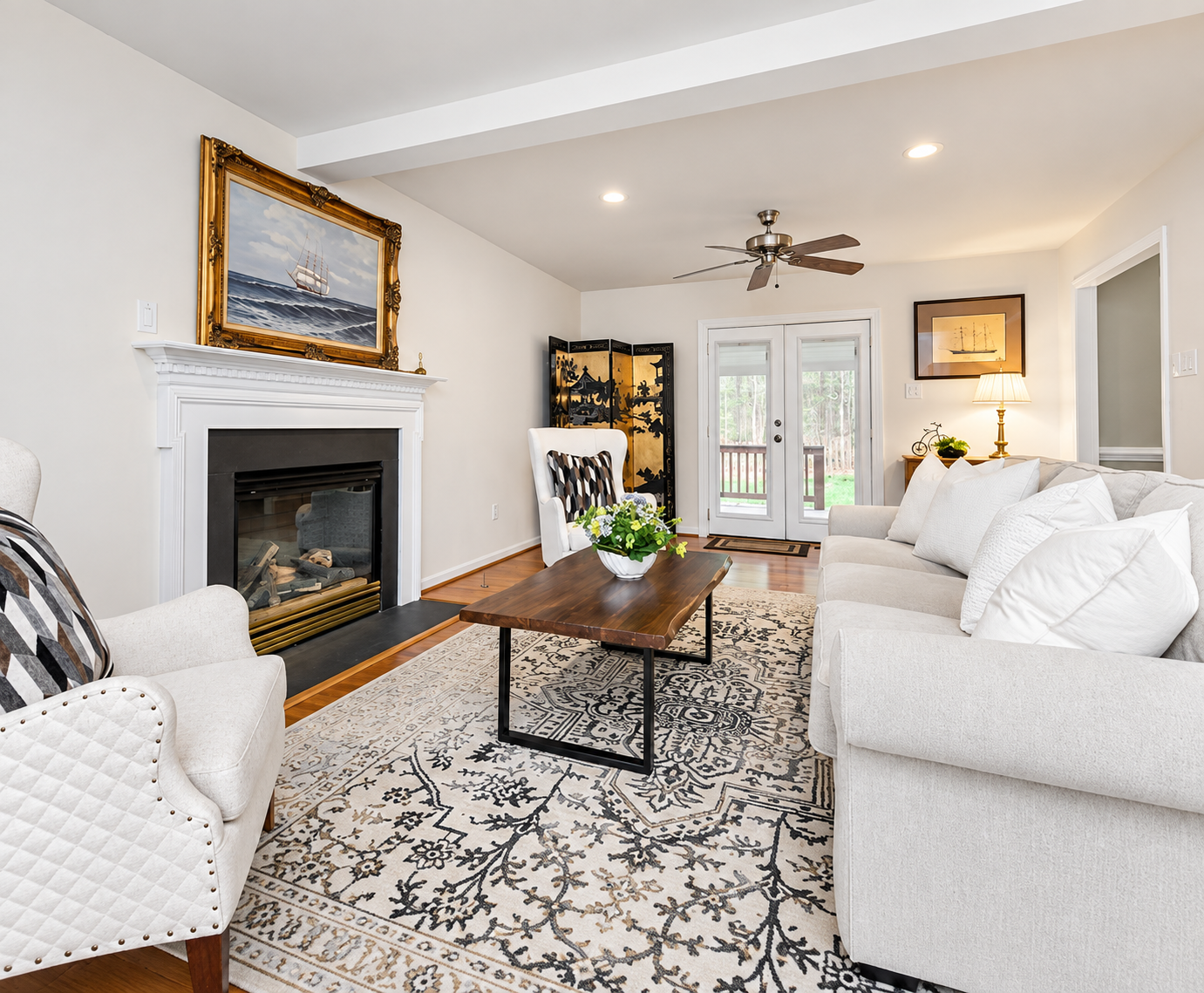 Enhanced occupied staging living room on Amber Forest Dr in Midlothian, Virginia