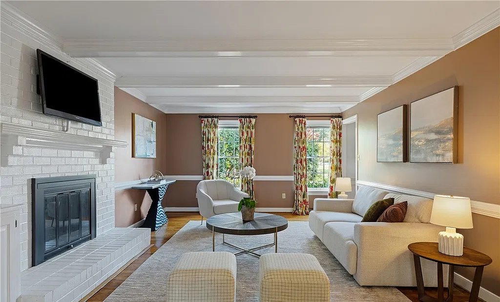 Professionally staged living room with fireplace on Ballantrae Ct in Henrico, Virginia