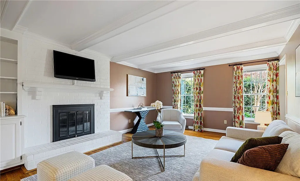 Professionally staged living room with fireplace on Ballantrae Ct in Henrico, Virginia